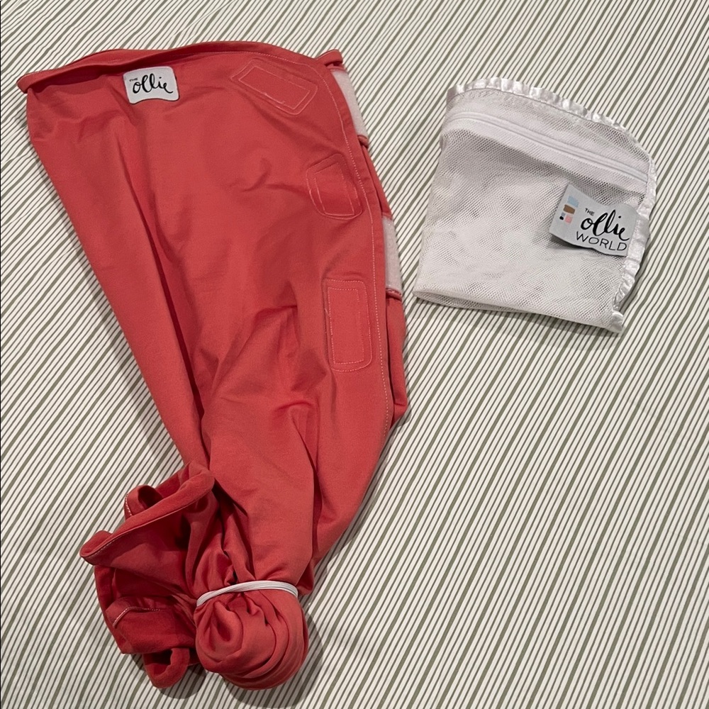 Ollie swaddle with mesh wash bag.
